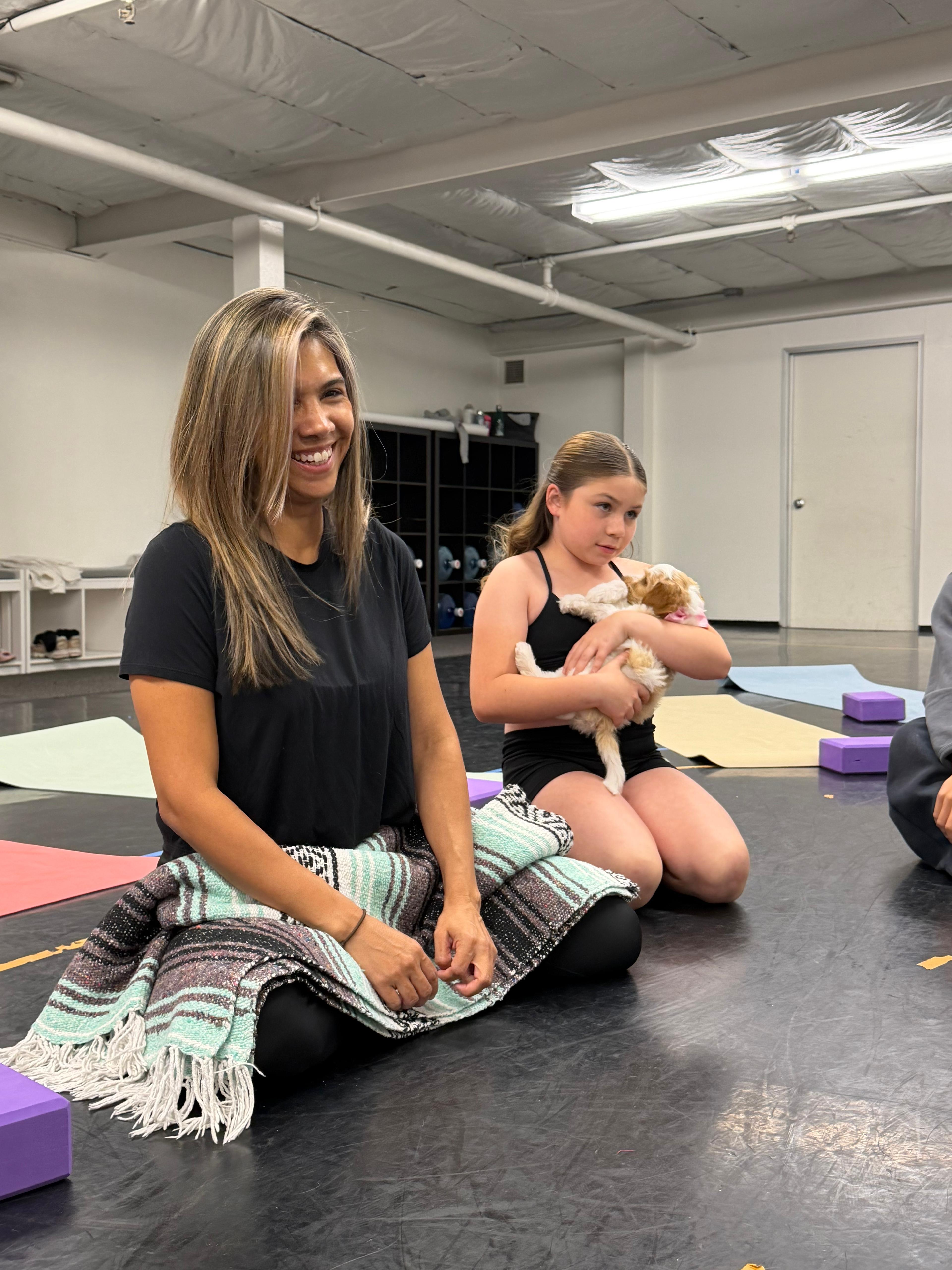 Corporate or school event — a team or classroom sitting with puppies