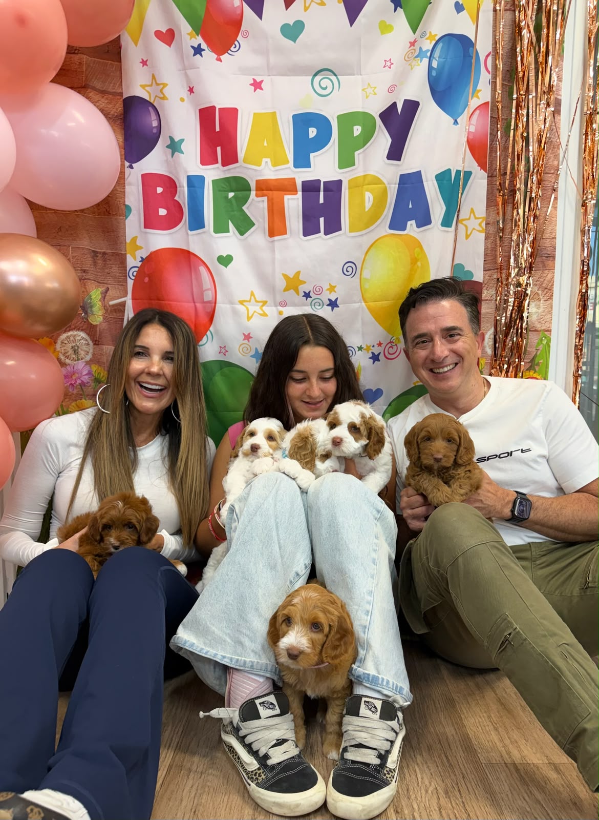Puppy party — a child's birthday, cake table, puppies on a rug